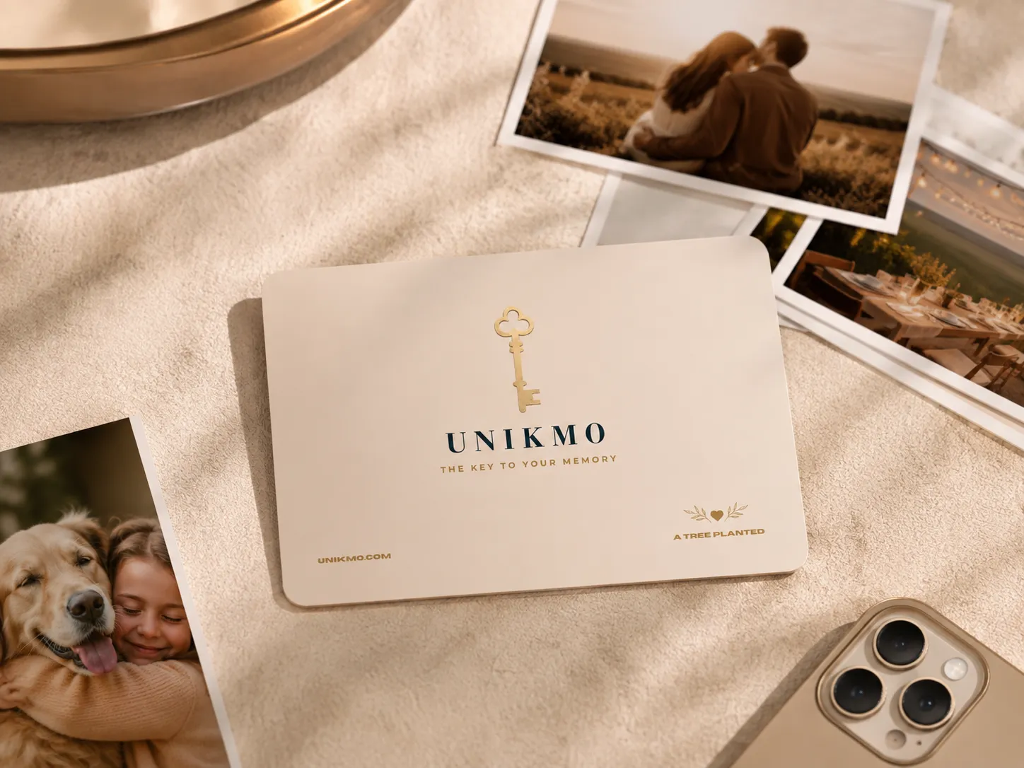 A finished UNIKMO keepsake card beside printed photos